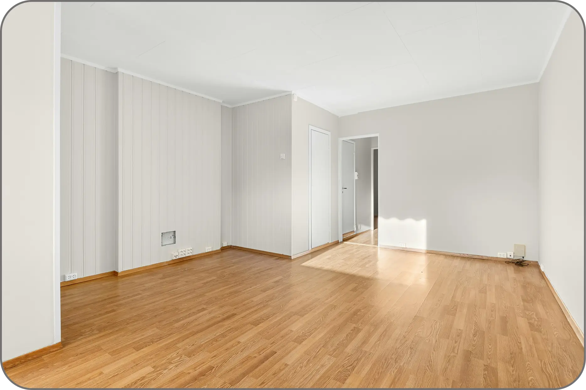 Big room with laminate flooring installed Big room with laminate flooring installed